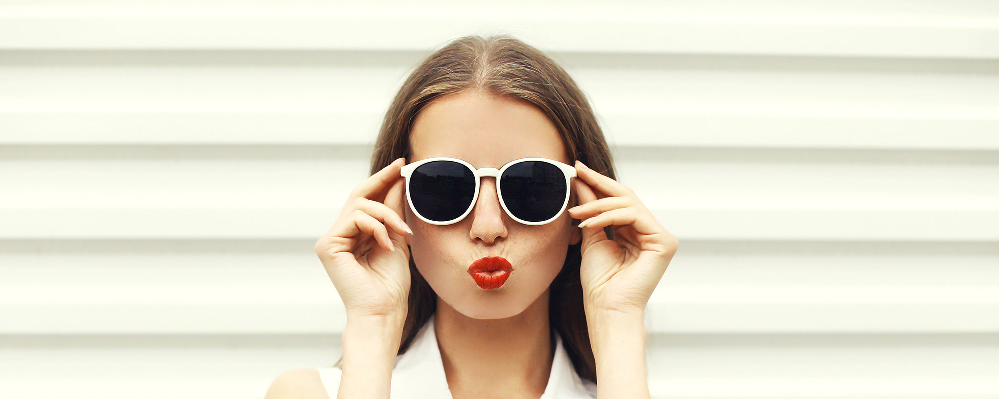 Woman In White Wearing Sunglasses